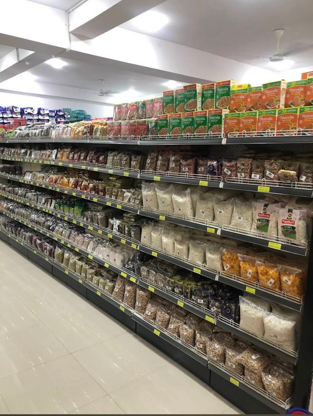 Neatly stocked grocery aisle at Co-Mart