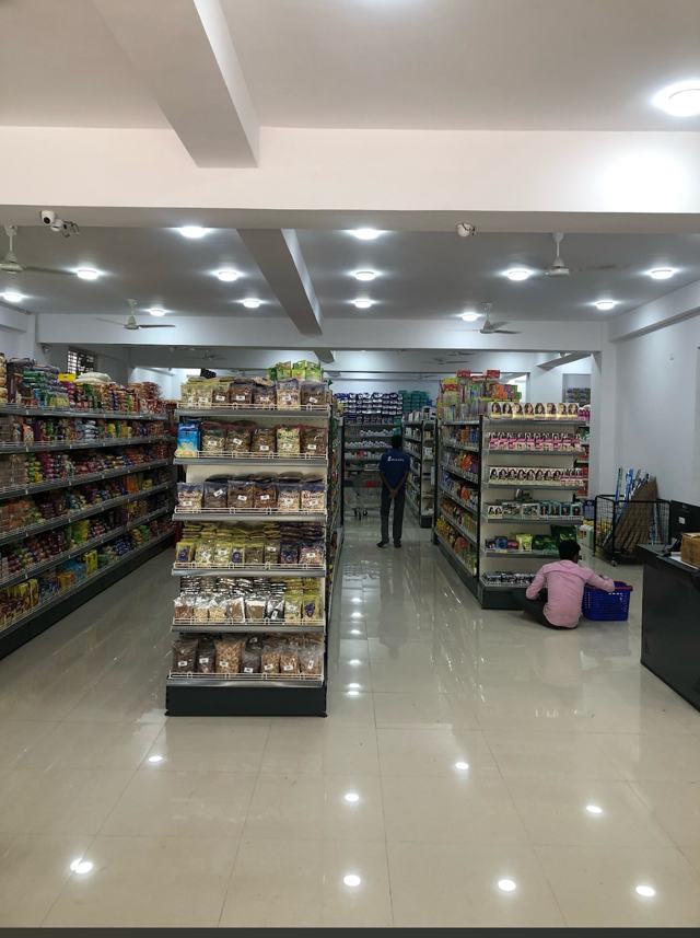 Spacious, well-lit aisles inside Co-Mart